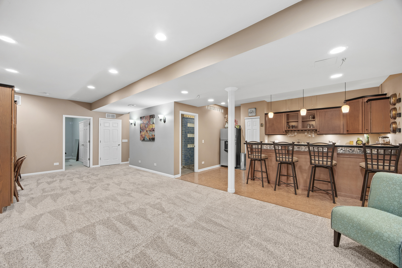 133 North Cranberry Street Bolingbrook, IL 60490 - Photo 33 of 46 a large white kitchen with kitchen island a island a stove a table and chairs