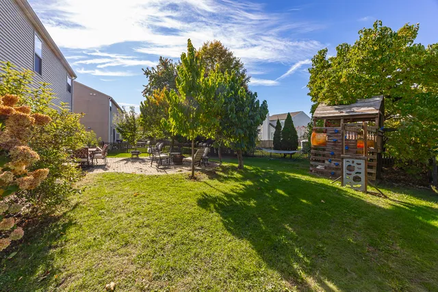 a view of an entryway with wooden floor and windows