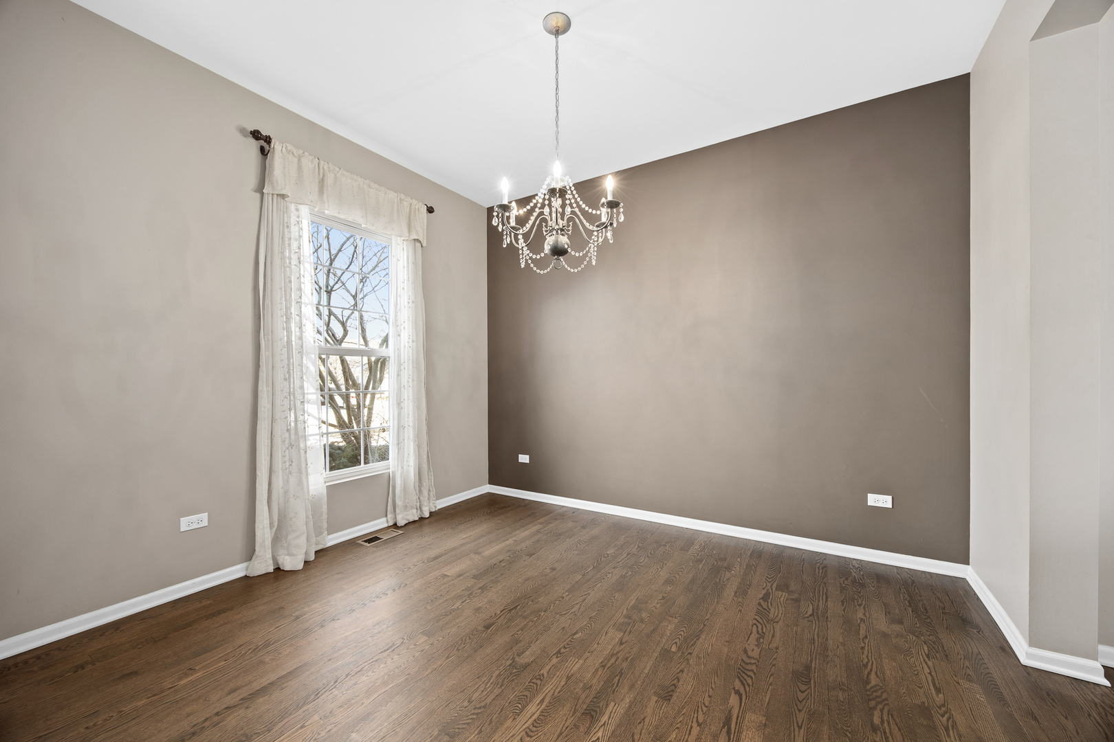 133 North Cranberry Street Bolingbrook, IL 60490 - Photo 10 of 46 an empty room with wooden floor and windows