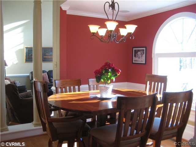 14471 Chepstow Road Midlothian, VA 23113 - Photo 8 of 12 a view of a dining room with furniture a chandelier and wooden floor