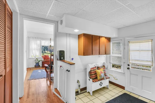 a bedroom with furniture and a wooden floor