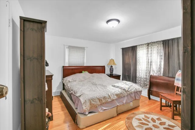 a bedroom with a bed and chair