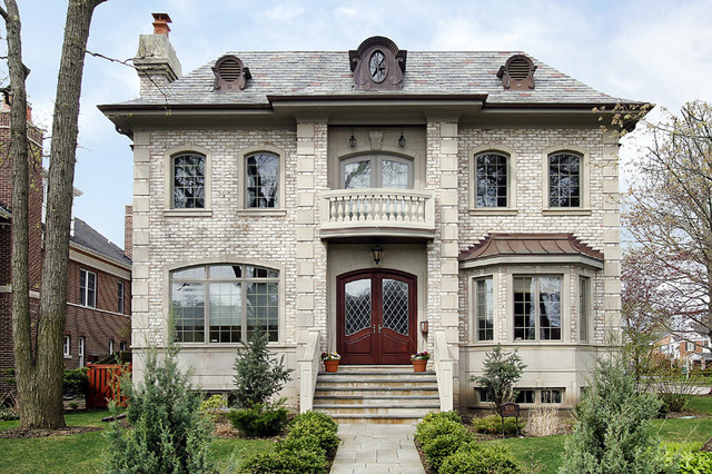 1055 Cherokee Road Wilmette, IL 60091 - Photo 1 of 25 a front view of a house with plants and entryway