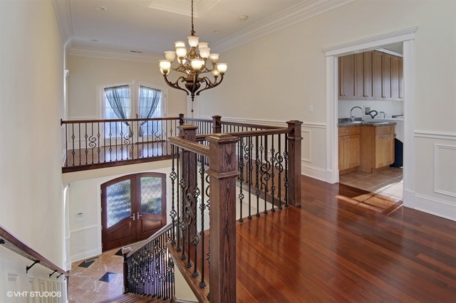 1055 Cherokee Road Wilmette, IL 60091 - Photo 13 of 25 a view of a livingroom with furniture wooden floor a chandelier