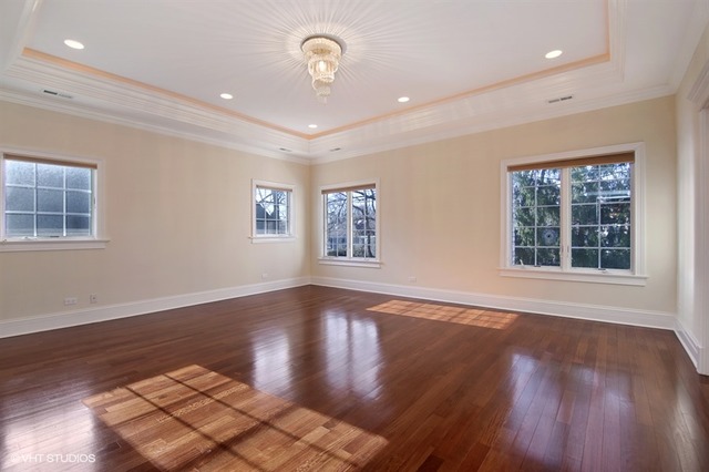 1055 Cherokee Road Wilmette, IL 60091 - Photo 14 of 25 a view of an empty room with wooden floor and a window