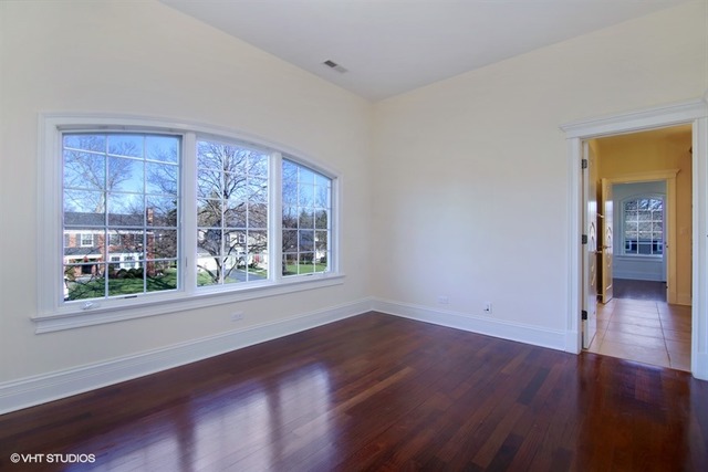 1055 Cherokee Road Wilmette, IL 60091 - Photo 16 of 25 a view of wooden floor and a window in a room
