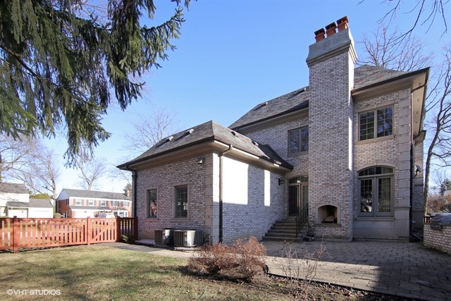 1055 Cherokee Road Wilmette, IL 60091 - Photo 24 of 25 a front view of a house with garden