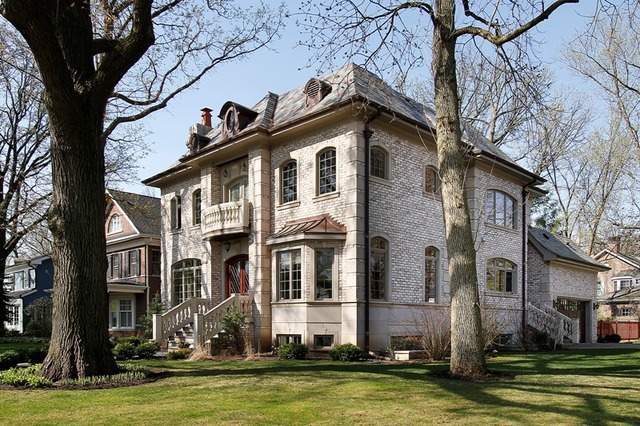 1055 Cherokee Road Wilmette, IL 60091 - Photo 25 of 25 a front view of a house with a large pool and large trees