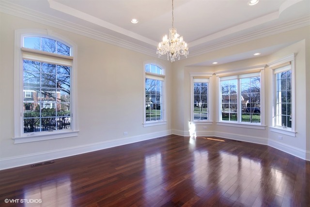 1055 Cherokee Road Wilmette, IL 60091 - Photo 4 of 25 a view of an empty room with wooden floor and a window