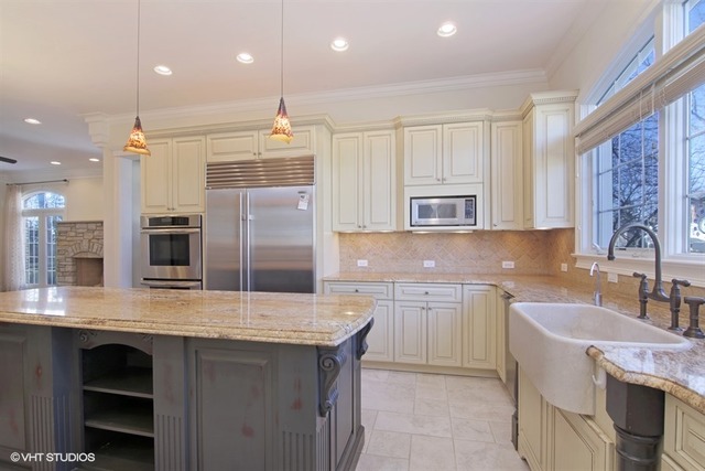 1055 Cherokee Road Wilmette, IL 60091 - Photo 8 of 25 a kitchen with stainless steel appliances granite countertop a sink a stove and a refrigerator