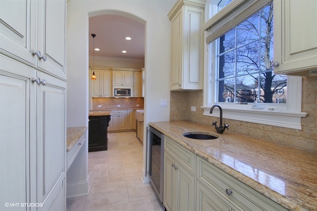 1055 Cherokee Road Wilmette, IL 60091 - Photo 9 of 25 a kitchen with granite countertop a sink and a stove