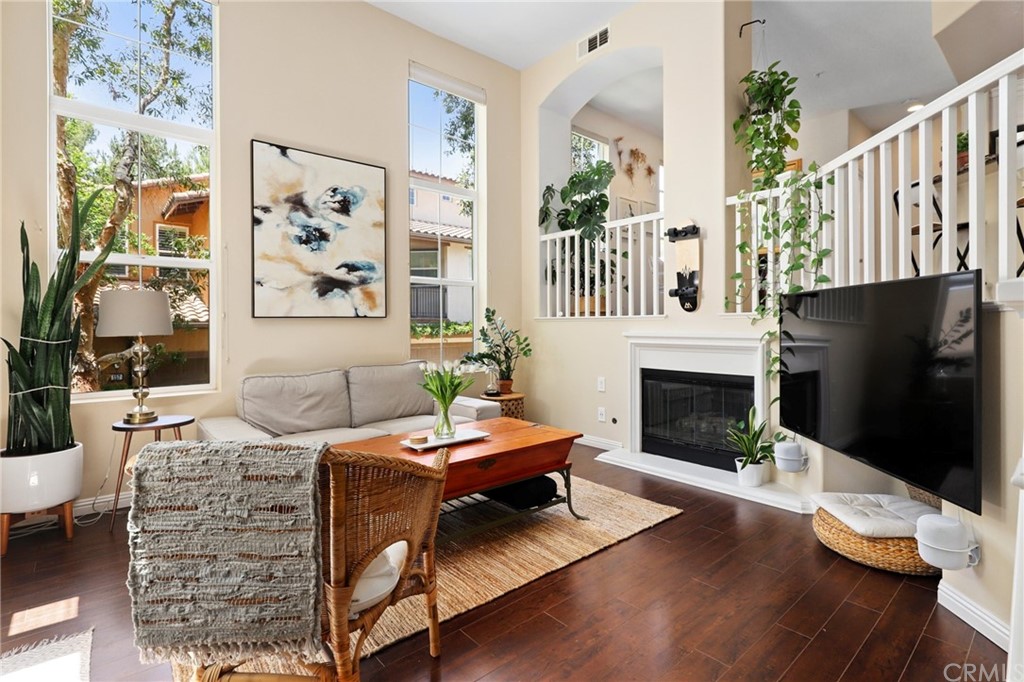 159 Stepping Stone Irvine, CA 92603 - Photo 1 of 1 a living room with furniture and a fireplace