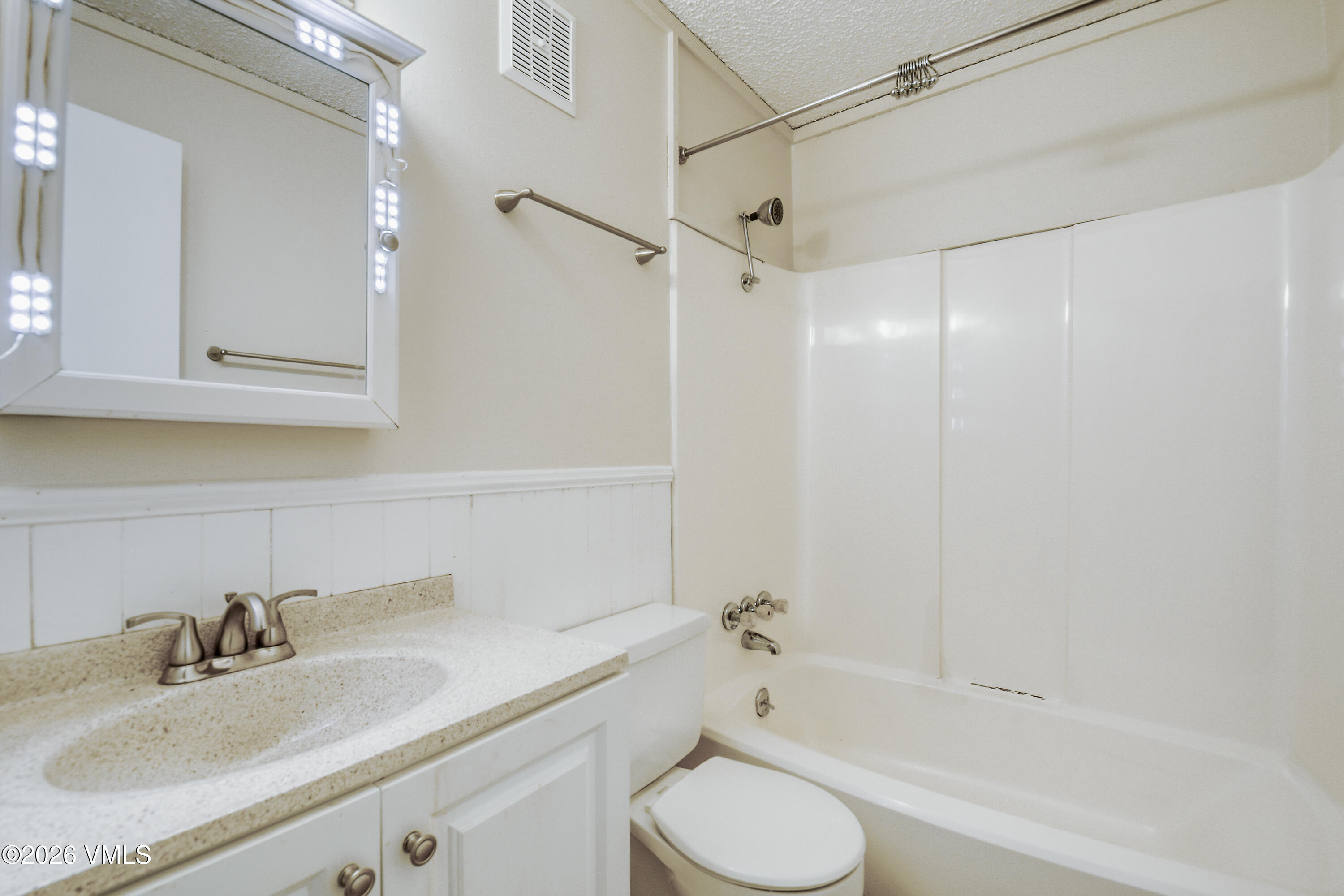 4506 Spruce Way, Unit 20 Vail, CO 81657 - Photo 11 of 17 a bathroom with a granite countertop sink toilet and shower