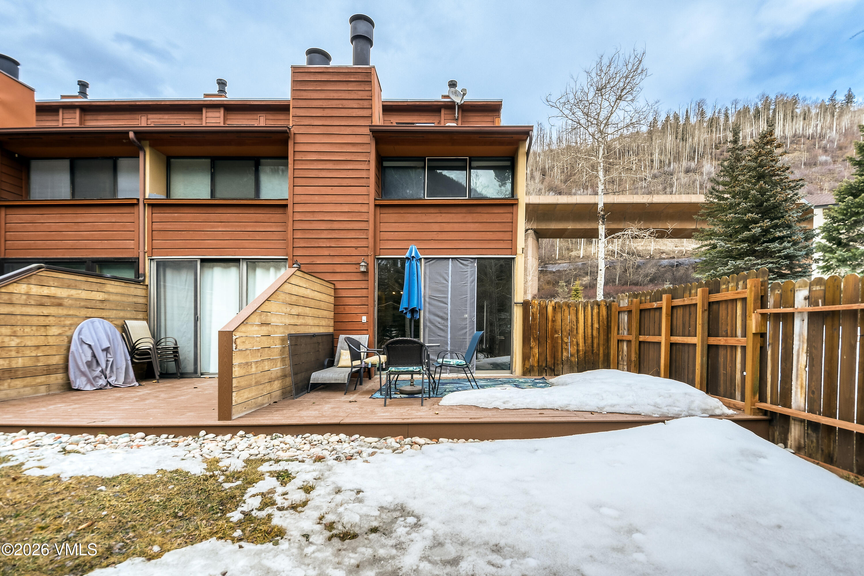 4506 Spruce Way, Unit 20 Vail, CO 81657 - Photo 13 of 17 a view of a building with a patio