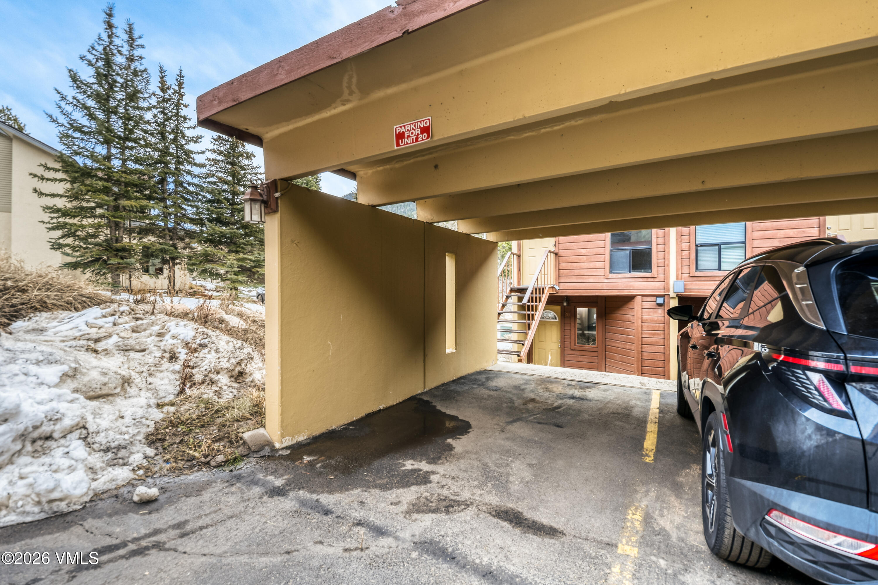 4506 Spruce Way, Unit 20 Vail, CO 81657 - Photo 17 of 17 a view of a garage with parked cars
