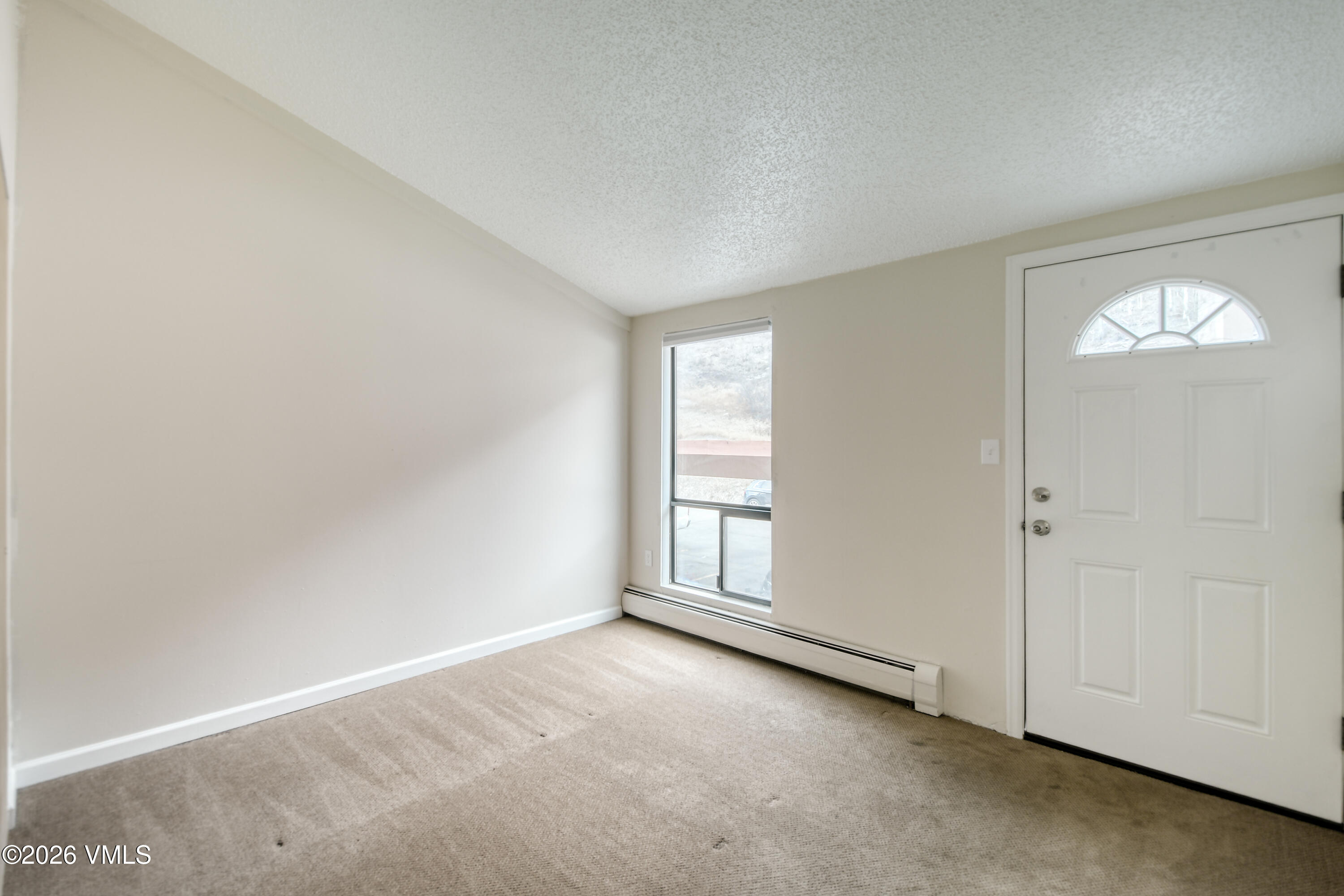4506 Spruce Way, Unit 20 Vail, CO 81657 - Photo 7 of 17 an empty room with windows