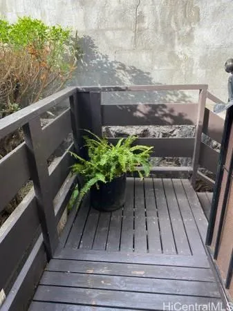 a view of balcony with wooden floor
