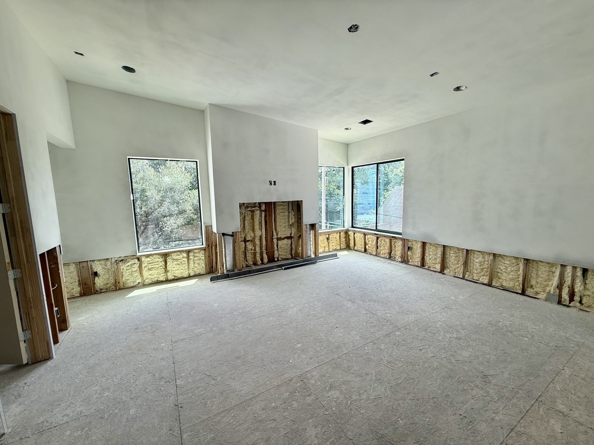 1701 Banks Street Houston, TX 77098 - Photo 17 of 50 a view of an empty room with a fireplace and a window