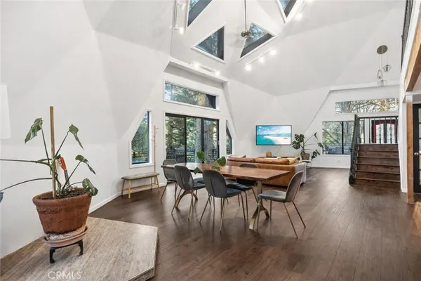 a view of a dining room with furniture window and wooden floor