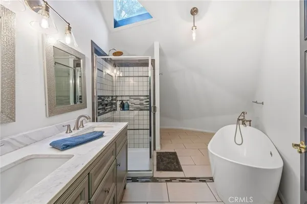 a bathroom with a toilet a sink and shower