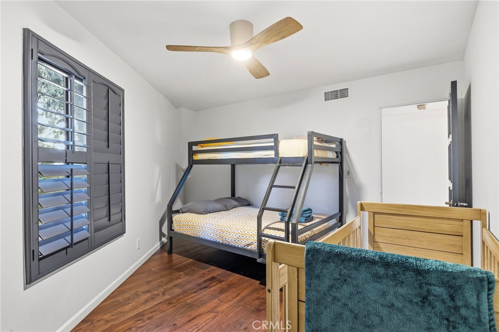 1349 Valley View Way Crestline, CA 92325 - Photo 22 of 43 a bedroom with a bed and a chandelier