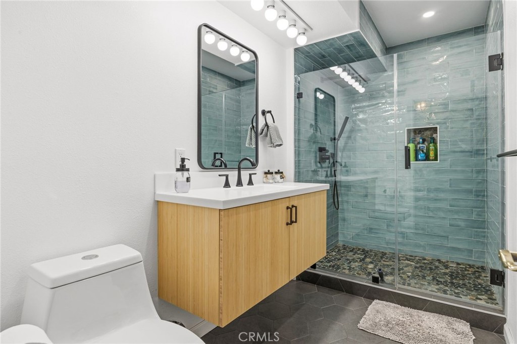 1349 Valley View Way Crestline, CA 92325 - Photo 24 of 43 a bathroom with a sink a toilet and shower