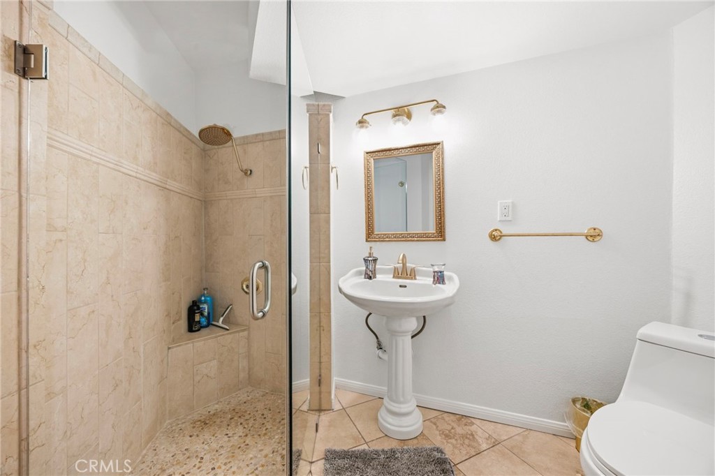 1349 Valley View Way Crestline, CA 92325 - Photo 29 of 43 a bathroom with a sink toilet and shower