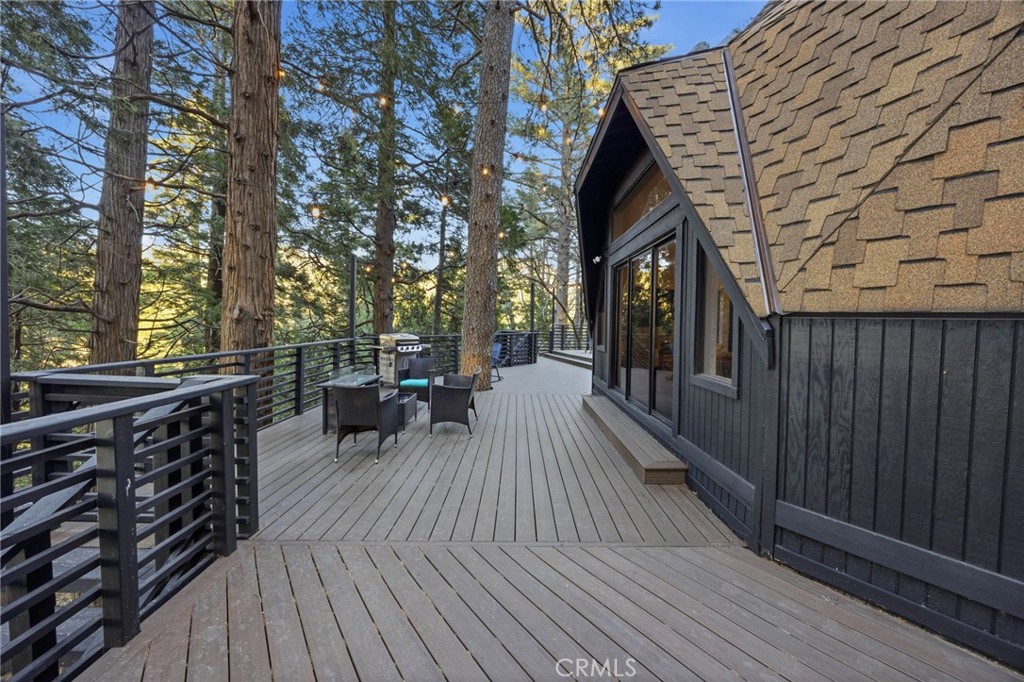 1349 Valley View Way Crestline, CA 92325 - Photo 32 of 43 a view of a balcony with chairs and wooden floor