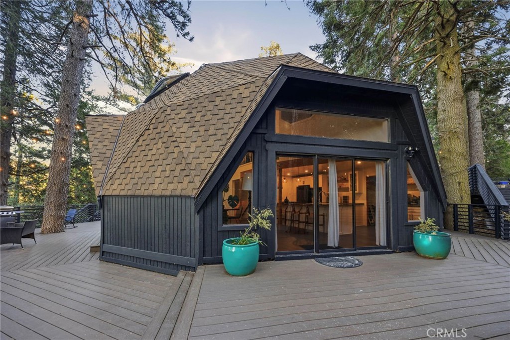 1349 Valley View Way Crestline, CA 92325 - Photo 35 of 43 a view of a house with large windows and plants