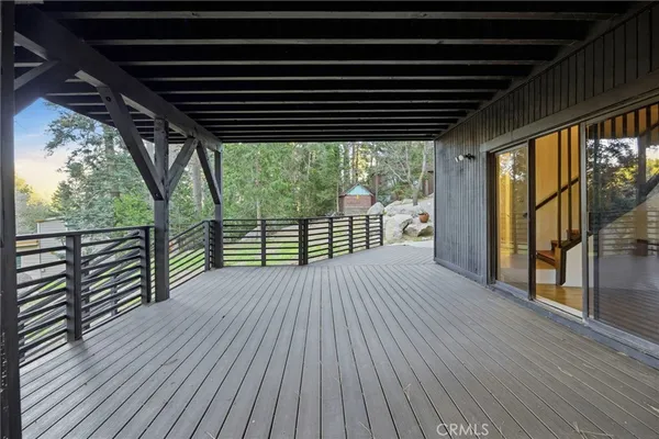 a view of a wooden deck with a bench