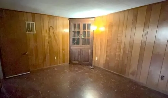 a view of entryway with wooden walls