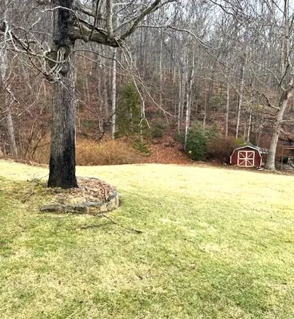 a swimming pool with trees in the background