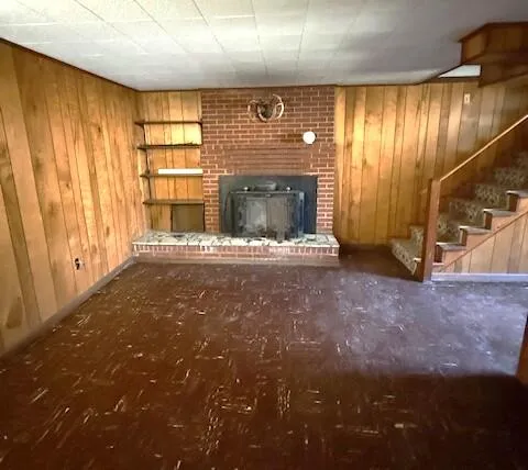 a view of an empty room with a fireplace