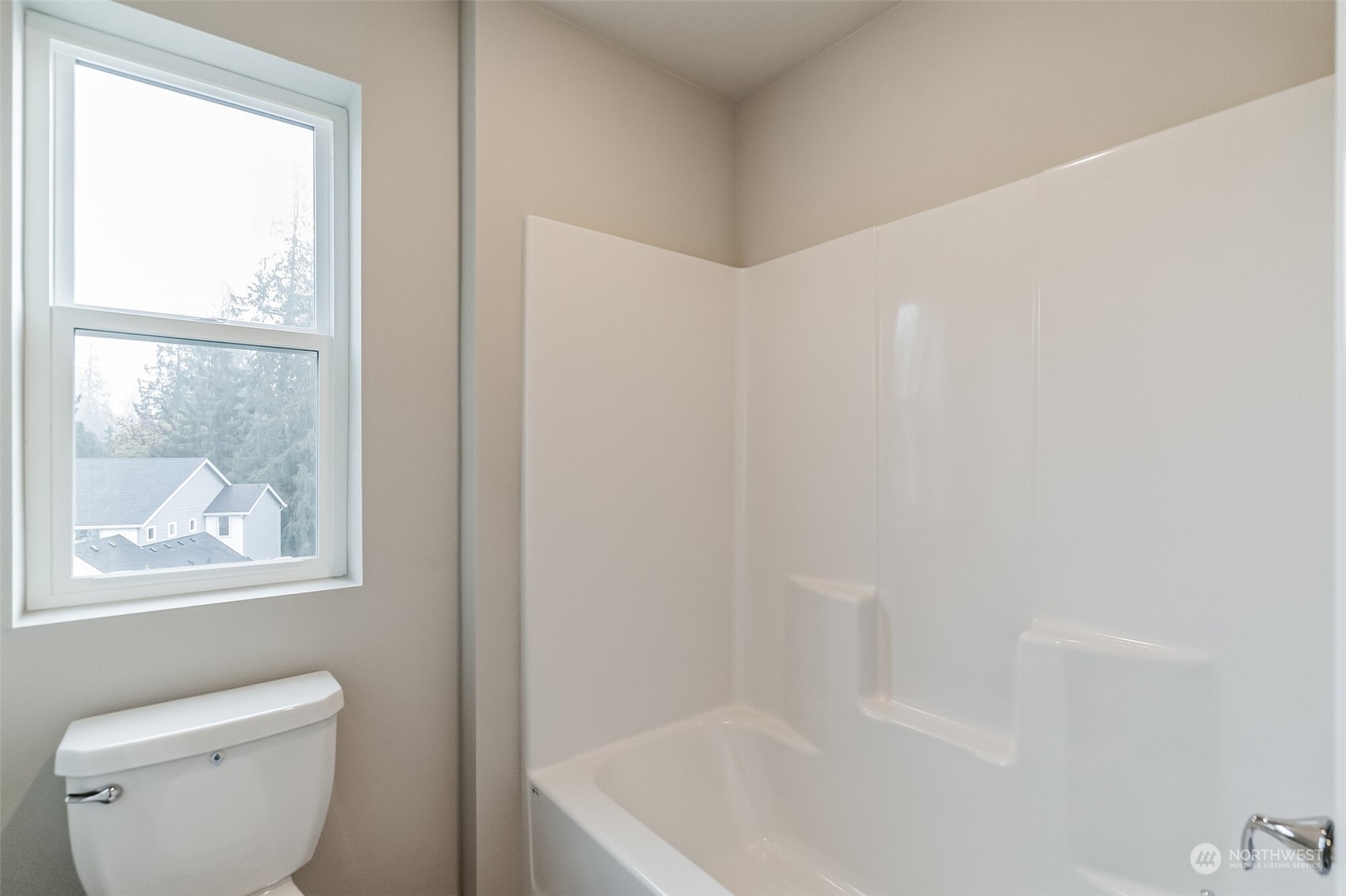 2734 South 8th Way Ridgefield, WA 98642 - Photo 6 of 20 a bath room with a toilet a bath tub and a window
