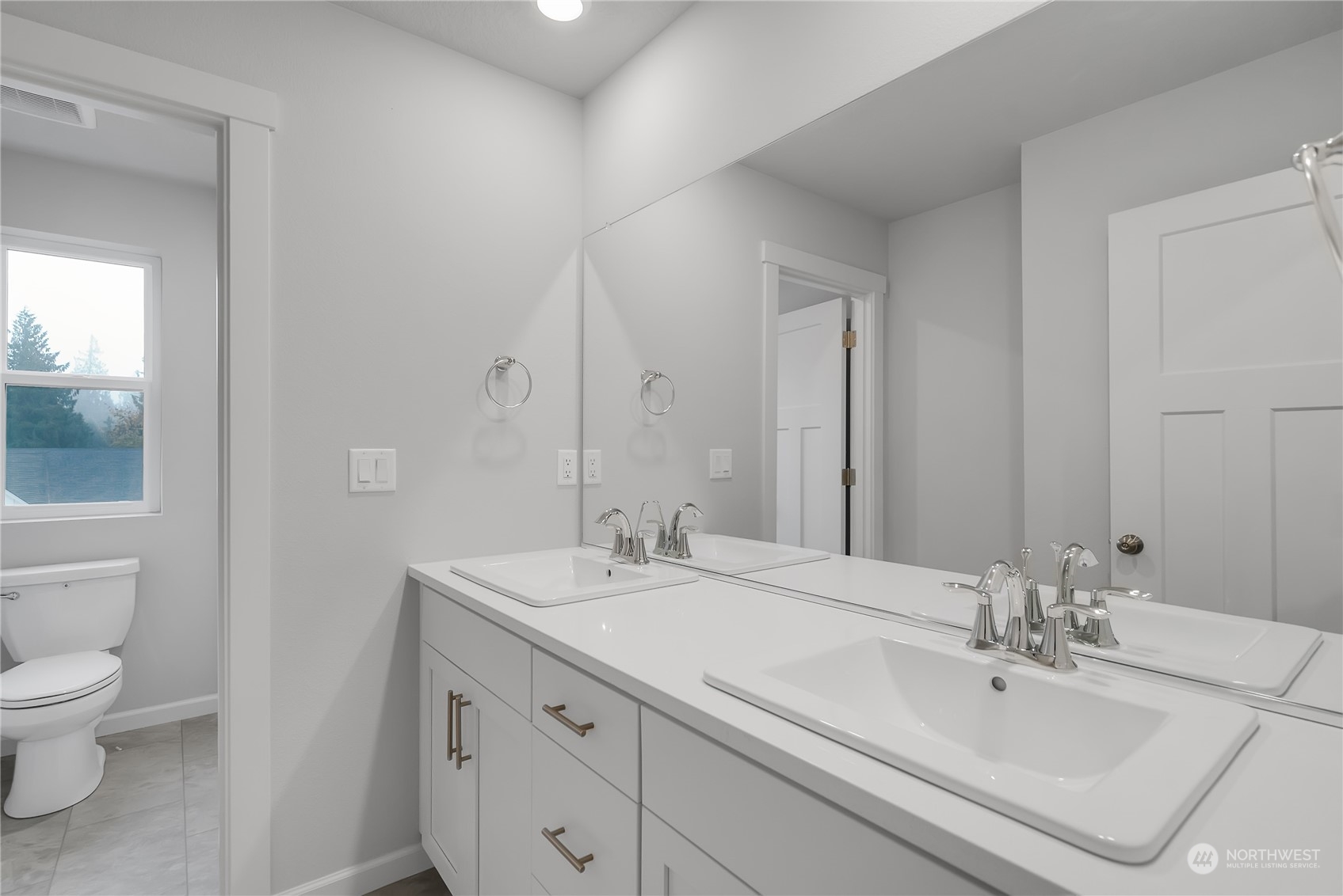2734 South 8th Way Ridgefield, WA 98642 - Photo 7 of 20 a bathroom with a sink and a mirror