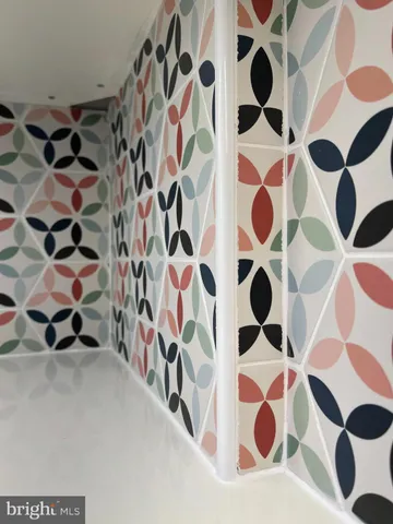 a view of a room with wooden floor and window