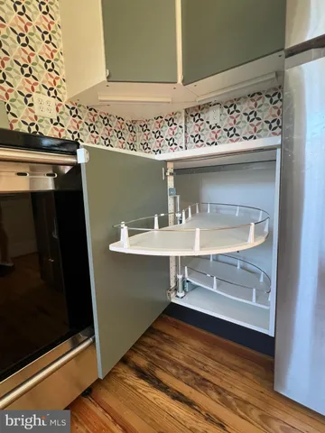 a view of staircase with wooden floor
