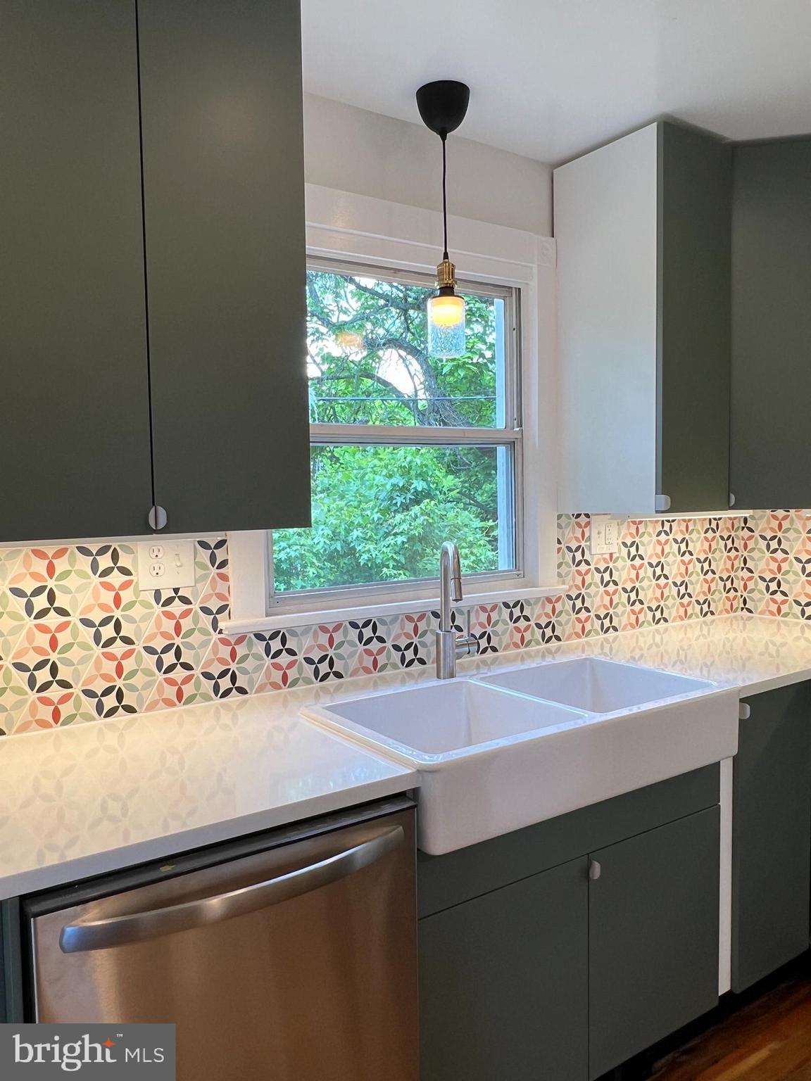 7308 Highbridge Road Bowie, MD 20720 - Photo 37 of 70 a sink with a window and wooden floor