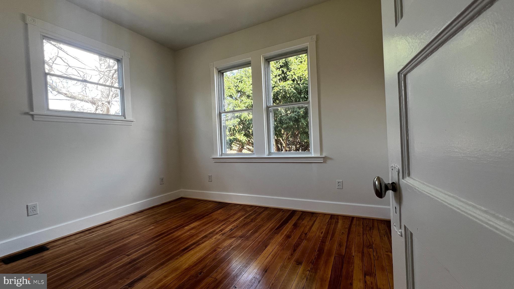 7308 Highbridge Road Bowie, MD 20720 - Photo 42 of 70 a view of a room with wooden floor and windows
