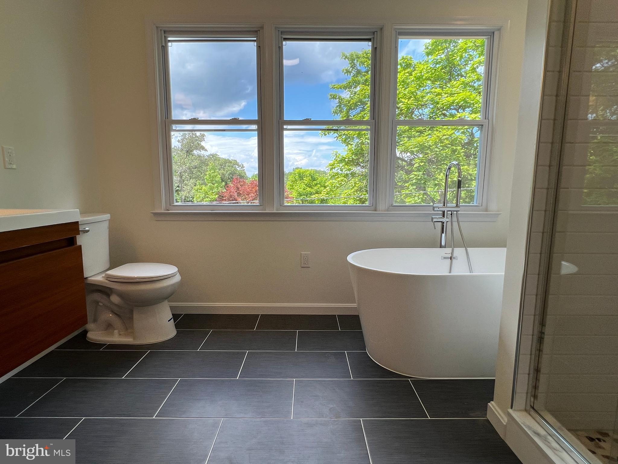 7308 Highbridge Road Bowie, MD 20720 - Photo 58 of 70 a bathroom with a toilet sink and mirror