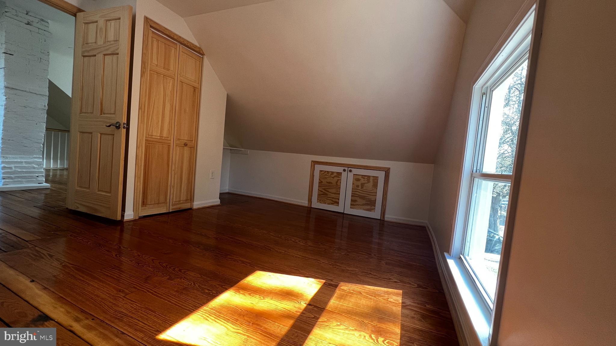 7308 Highbridge Road Bowie, MD 20720 - Photo 63 of 70 an empty room with wooden floor and windows