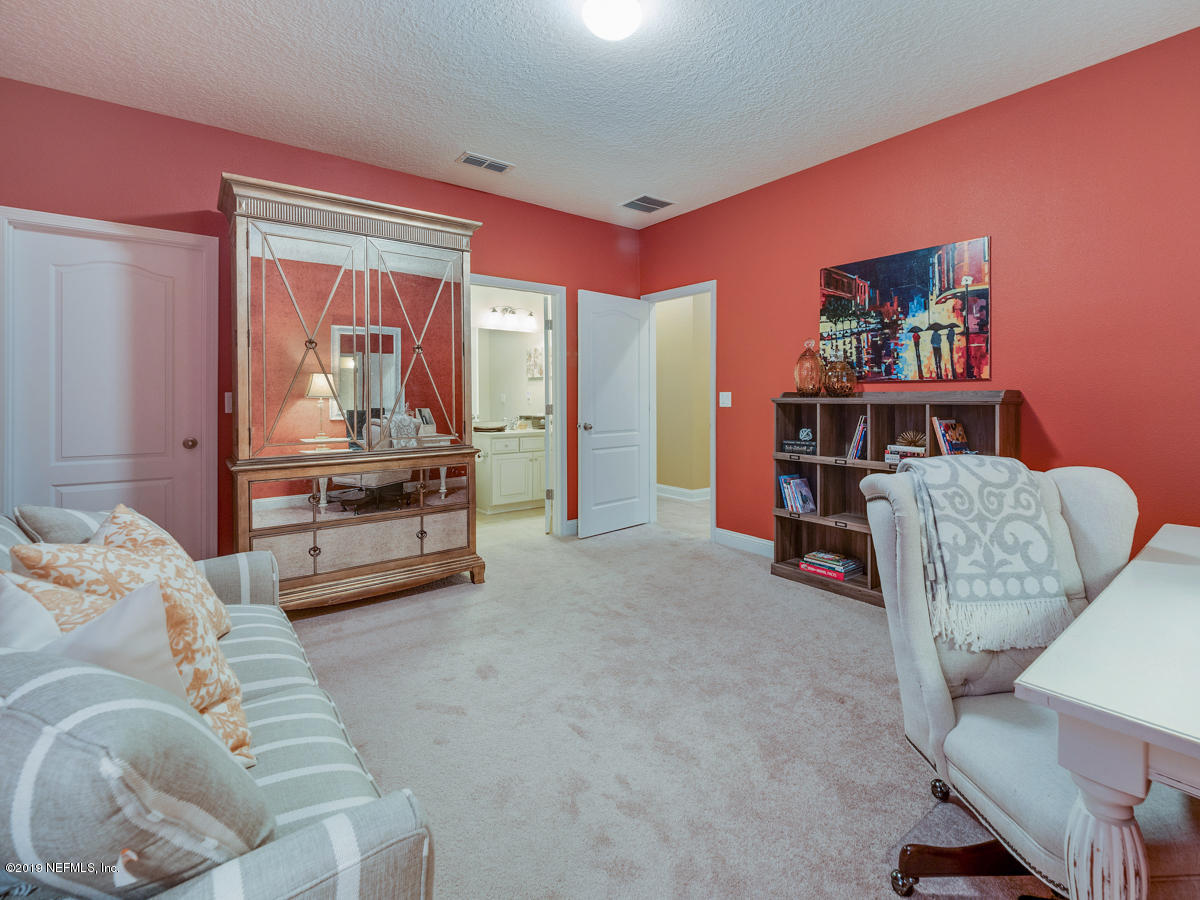 702 Irish Rose Road St. Augustine, FL 32092 - Photo 26 of 53 a living room with furniture and a couch