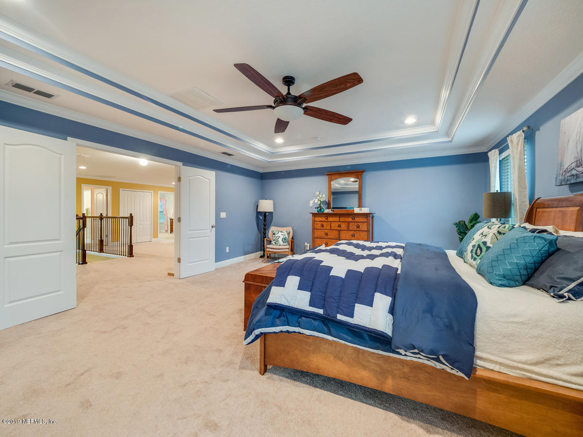 702 Irish Rose Road St. Augustine, FL 32092 - Photo 33 of 53 a bedroom with a large bed and window
