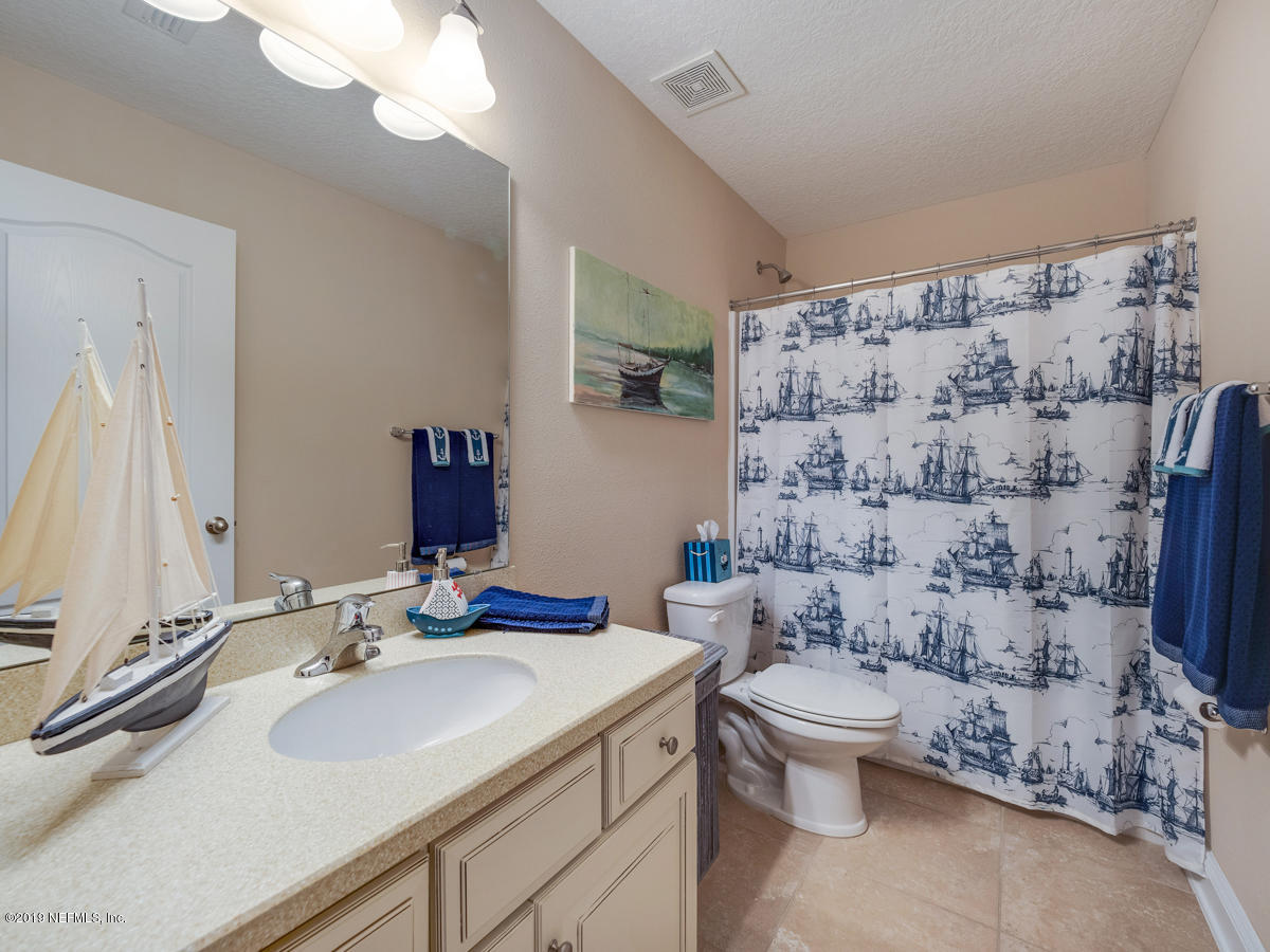 702 Irish Rose Road St. Augustine, FL 32092 - Photo 42 of 53 a bathroom with a sink toilet and shower