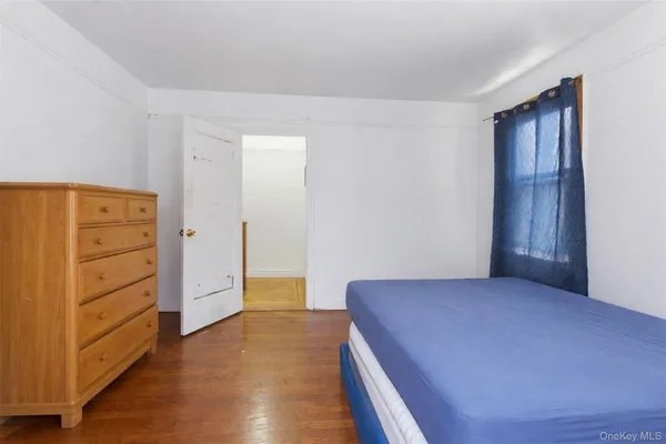 a bedroom with a bed and cabinets