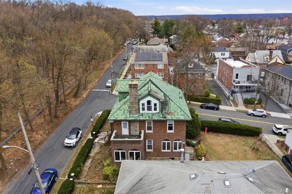 an aerial view of a house with outdoor space