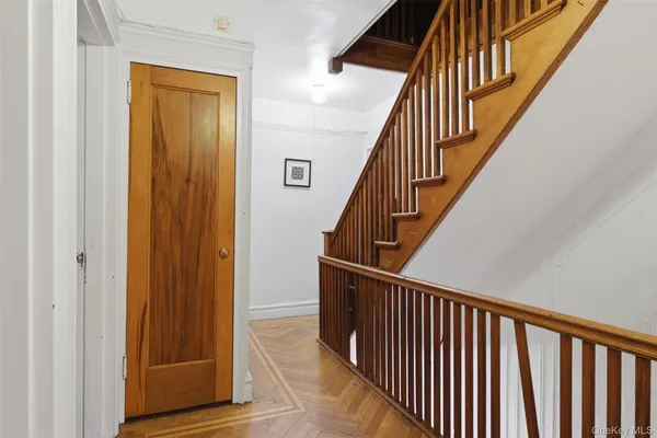 a view of staircase with wooden floor and stairs