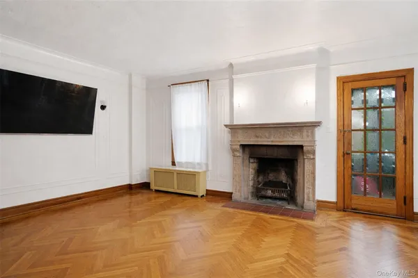 a living room with a flat screen tv and a fireplace