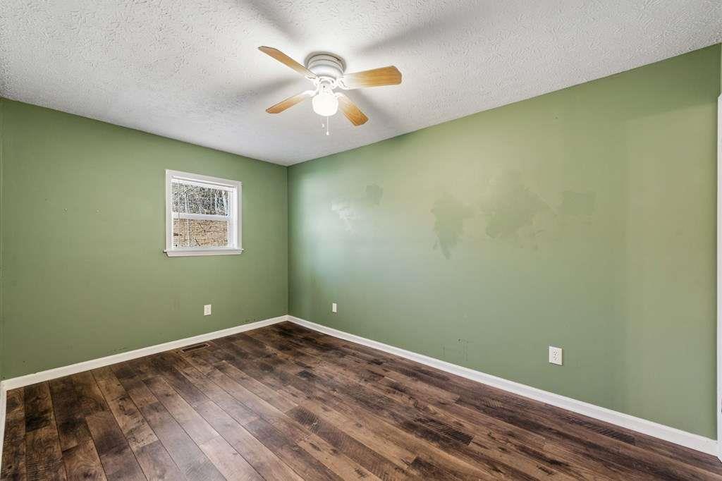 118 Jordan Road Blairsville, GA 30512 - Photo 28 of 49 a view of a room with a large window and chandelier fan