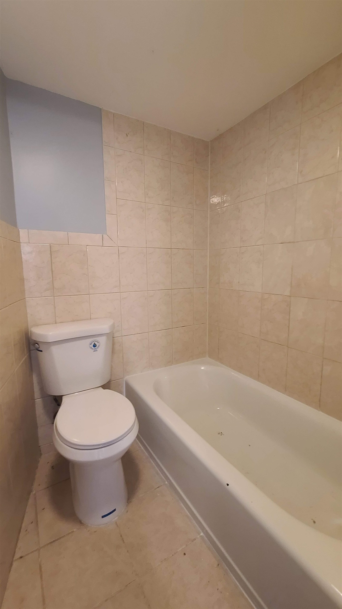 6206 Newkirk Avenue, Unit 1 North Bergen, NJ 07047 - Photo 15 of 20 a white toilet sitting next to a bath tub
